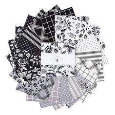 a pile of black and white paper with flowers on it