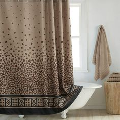 a bath tub sitting next to a window in a bathroom