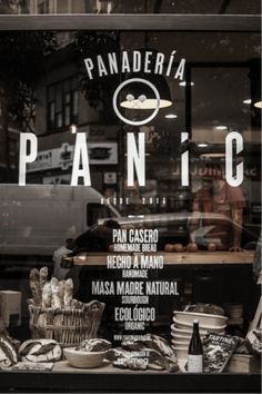 panaderia's window with bread and pastries displayed in it