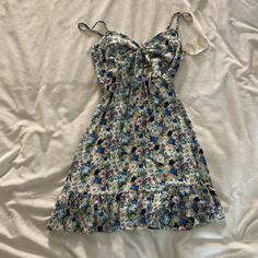 Very Gorgeous Vintage Vibe Flower Patterned Mini Dress! Size Medium In Perfect Condition. New With Tags! No Rips, Tears, Or Stains! Tie In The Front With A Triangle Cut Out! Blue Ditsy Floral Print Dress For The Beach, Cute Flowy Floral Print Dress, Purple Floral Print Sundress For Spring, Casual Floral Print Mini Dress For Garden Party, Spring Purple Floral Print Sundress, Spring Floral Print Purple Sundress, Summer Floral Print Daytime Dress, Cute Floral Print Dress For Brunch, Purple Floral Print Sundress For Summer