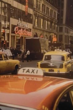 taxi cabs and taxis on a busy city street