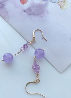 Thank you for your interest in this gorgeous pair of amethyst drop earrings. = = = = = = = = = = ♥. Product facts: - Natural crystals; - Ear wire closure; - The spiritual meaning of Amethyst is groundedness, tranquility, and calm; - Bead size: 9mm;  - Earring length: 5.0cm/2.0"; drop length: 3.5cm/1.4"; - For reference, the diameter of the plate in display is 6"; the height of the jewelry display stand is 7.25". ♥. Things to keep in mind: - Most of the products come with certificates; for those Elegant Purple Earrings For Pierced Ears, Elegant Purple Drop Crystal Earrings, Elegant Lavender Earrings With Ear Wire, Elegant Lavender Dangle Crystal Earrings, Elegant Lavender Crystal Dangle Earrings, Single Purple Drop Earring, Purple Single Drop Earring, Elegant Lavender Drop Earrings, Lavender Pierced Earrings For Gift