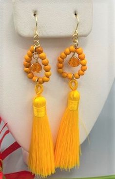 Beautiful long earrings made with a bright yellow tassel one crystal glass bead, 925 sterling silver wire and earrings hook,  and small  orange turquoise beads Made with love and dedication, Feel free to ask for different colors, Orange Tassel Dangle Earrings, Adjustable Orange Tassel Earrings, Orange Beaded Tassel Earrings As Gift, Orange Tassel Drop Earrings As Gift, Orange Tassel Drop Earrings, Orange Tassel Drop Earrings For Gift, Orange Tassel Earrings Gift, Orange Tassel Earrings, Orange Tassel Jewelry For Summer