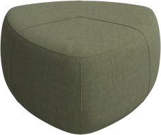 a large green ottoman sitting on top of a white floor