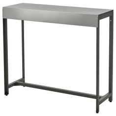 a metal table with two legs and a shelf on the top that has a white background