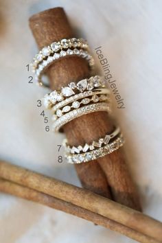 three stacking rings sitting on top of each other next to a stick with cinnamon sticks