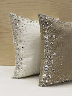 two pillows with silver sequins on them