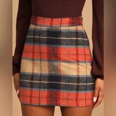 “From A High Banded Waist, Soft Woven Flannel Fabric In Rust Orange, Navy Blue, And Beige Plaid Descends Into A Mini, A-Line Silhouette. Exposed Brass Side Zipper/Clasp.” Nwt- Bought To Try On For Event, Didn’t Choose It But Missed Return Window. Size Medium, More Orange Than Red-Orange As Pictures Showed Online Multicolor Fall Skirt, Fall Multicolor Skirt, Fitted Orange Mini Skirt For Fall, Fitted Orange Bottoms For Winter, Orange Casual Mini Skirt For Fall, Casual Orange Mini Skirt For Fall, Orange Skirt For Fall, Multicolor Mini Skirt For Fall, Trendy Orange Skirt For Fall