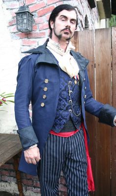 Tally Ho!   "Pull up your socks and chase the fox, a hunting we will go."  Men's fashion has become somewhat boring, you'll pardon my saying so. But it wasn't always. A good example is the ever-popular cut-away riding frock coat popular from the 1780s to the 1820s. A functional and yet swaggering, rakish garment if there ever was one, for both gentlemen and scoundrel. Pulled from an antique pattern, this treatment, the Royal Blue Swallowtai Steampunk Pirate Wedding Jacket is historically accurat A Hunting We Will Go, Pirate Wedding, Antique Pattern, Revival Clothing, Steampunk Pirate, Diamond And Silk, Tally Ho, Attract Men, Wedding Jacket