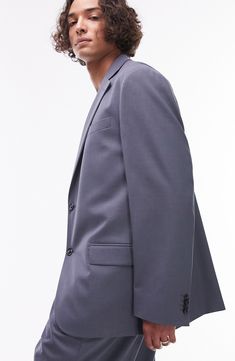 Stride through the office with confidence in this sleek jacket made with notched lapels and designed for a relaxed fit. 31" length (size 42) Two-button closure Notched lapels Nonfunctional four-button cuffs Chest welt pocket; front flap pockets Lined 69% polyester, 29% viscose, 2% elastane Dry clean Imported Career Suits With Single Breasted Lapel Collar, Single Breasted Suits With Lapel Collar For Career, Career Suits With Lapel Collar And Hidden Button Closure, Career Suits With Hidden Button Closure And Lapel Collar, Career Suits With Single Button And Lapel Collar, Professional Blazer With Suit Collar In Solid Color, Professional Solid Blazer With Suit Collar, Professional Solid Color Blazer With Suit Collar, Formal Blazer With Hidden Button Closure