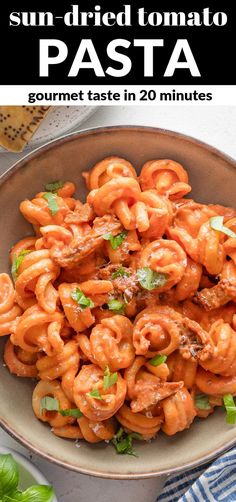 sun dried tomato pasta in a bowl with basil on top and the title above it