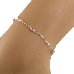 Pretty in pink anklet made with small 4mm Swarovski crystals, soft pink in color, and sterling silver chain.  The anklet has a sterling silver lobster clasp.  Lovely, understated, and dainty ankle bracelet. Available in many sizes.  Please choose the size that you need from the drop-down menu, bearing in mind that the anklet size you order should be approximately one inch larger than the size of your ankle.  The anklet will arrive in an attractive gift box. Cheap Pink Round Bead Anklets, Elegant Adjustable Pink Anklets, Elegant Pink Adjustable Anklets, Pink Anklet, Dainty Anklet, Teardrop Pearl Earrings, Trip Outfit, Cloisonne Jewelry, Crystal Anklet