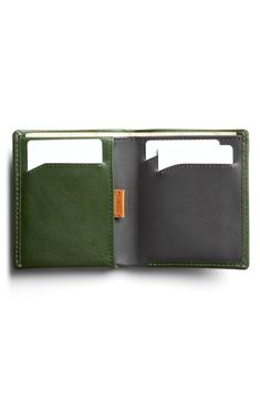 A well-organized interior ensures superior easy and convenience with this RFID-protected wallet. It has a smart pull-tab compartment so you don't have to dig for things, and its made from premium calfskin for lasting appeal. Interior currency pouch; pull-tab slip pocket; three card slots Leather Imported Green Leather Card Holder With Rfid Blocking, Green Leather Rfid Blocking Card Holder, Green Classic Wallet With Rfid Blocking, Classic Green Wallet With Rfid Blocking, Green Rfid Blocking Wallets For Business, Versatile Rectangular Leather Card Holder, Modern Trifold Wallet For Everyday Use, Green Rfid Blocking Wallet For Business, Modern Trifold Wallet With Card Slots