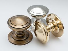 an assortment of knobs and pulls on a white background