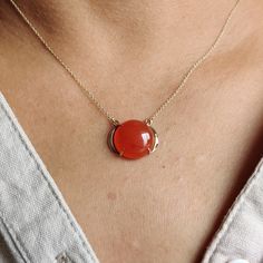 "ITEM DESCRIPTION: >>The pendant is made from Solid 14K Yellow Gold. Gemstone used is absolutely natural and ethically sourced. >>Natural Red Onyx in cabochon cut and round shape with a prong setting is studded on it with utmost precision. >>This is a minimalist design and is absolutely hassle-free and everyday jewelry. Gem: Red Onyx Gem size: 14x14 mm Gem weight: 8.44 carats Gold purity: 14K (58.33% approx.) Gold weight: 1.45 grams Gross weight: 3.14 grams These pendant comes with 16\" inches a Elegant Red Cabochon Gemstones, Elegant Red Polished Gemstones, Fine Jewelry Round Cabochon Necklaces, Yellow Gold Pendant Jewelry With Large Stone, Ruby Necklace With Polished Yellow Gold Finish, Ruby Cabochon Pendant Jewelry, 14k Yellow Gold Jewelry With Large Stone, Fine Jewelry Cabochon Necklaces For Anniversary, Yellow Gold Ruby Necklace With Polished Finish