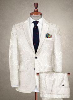 Enhance your suit collection with our exquisite Italian Silk Cinea suit, exuding fashion and style in every stitch. Meticulously crafted from a luxurious blend of silk, cotton, and lycra, this suit boasts a modern silhouette adorned with a sophisticated jacquard design on a sleek off-white hue. Perfect for a wedding party or any special occasion, it epitomizes elegance and refinement. Elevate your wardrobe with this impeccable ensemble and make a statement wherever you go. 
 
An elusive unique p Custom Tailored Suits, Blue Linen Shirt, Grey Wool Suit, Brown Corduroy Jacket, Suit Collection, Jacquard Design, Cashmere Jacket, Tweed Suits, Tuxedo Shirts