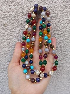 material: Color natural stone Made of natural stones, this necklace consists of all kinds of natural stones. It will give you positive energy and healing. It will look great on your neck. Please feel free to send me a message about the product and I will reply you immediately. https://www.etsy.com/shop/Hirajewelrydesign?ref=seller-platform-mcnav Healing Beaded Necklaces With Round Natural Stones, Healing Beaded Necklaces With Natural Stones And Round Beads, Spiritual Crystal Necklaces With Colorful Round Beads, Bohemian Multicolor Crystal Necklace With 108 Beads, Holistic Agate Jewelry With 108 Beads, Multicolor Handmade Spiritual Mala, Handmade Multicolor Spiritual Mala, Holistic Multicolor Gemstone Beads Jewelry, Gemstone Round Beads Necklaces For Meditation