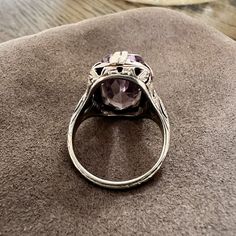 Centering a rectangular faceted amethyst measuring approx. 16.7 x 8.6 mm, fashioned in 18k white gold. Size 5. ______ At Doyle & Doyle, jewelry is as sustainable as it is beautiful. Our vintage and antique jewelry is innately ethical and conflict-free as it does not involve any new mining or negative environmental impact. We are proud that our in-house jewelry line Heirloom by Doyle & Doyle is made exclusively for us by our team of expert jewelers in New York City. These jewels are created in recycled gold, platinum, and silver and set with conflict-free natural diamonds and gemstones. Contemporary jewelry not included in our Heirloom by Doyle & Doyle line is created in recycled metals and set with conflict-free natural gemstones whenever possible. Classic Wedding Gemstones With Diamond Cut, Classic Amethyst Jewelry With Center Stone, Classic Oval Amethyst Ring With Prong Setting, Elegant Octagon Amethyst Ring For Formal Occasions, Classic Amethyst Ring With Rectangular Stone, Classic Amethyst Jewelry With Prong Setting, Classic Amethyst Ring With Rectangular Stone For Gift, Classic Jewelry With Prong Setting Amethyst, Formal Purple Rings With Rectangular Stone