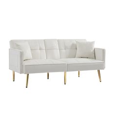 a white couch sitting on top of a wooden frame