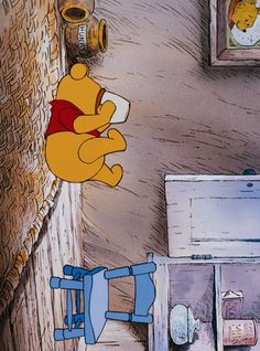 winnie the pooh flying over a toilet in a room with pictures on the wall