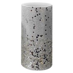 a white vase with silver and black speckles on the outside, in front of a white background