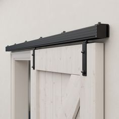 an open sliding door with black hardware on the top and bottom bars attached to it