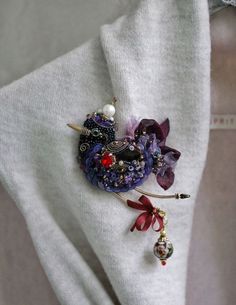 a close up of a piece of clothing with brooches on it