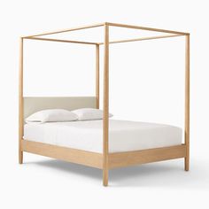 a gold metal bed frame with white linens on the bottom and sides, against a white background