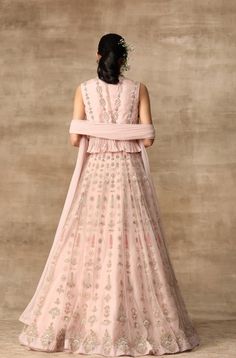 Editor's Note This set features a beautiful blush pink embroidered organza peplum top with a linear motif net lehenga and a gota embroidered net dupatta. The intricate embroidery and embellishments add a touch of elegance and glamour to the outfit, making it perfect for a special occasion such as a wedding Fabric: Net; organza; chiffon Color: Blush pink Components: Lehenga, peplum and dupatta Occasion: Engagement Disclaimer: Product color may slightly vary due to photographic lighting sources or Luxury Pink Net Sets, Luxury Chiffon Blouse Piece With Sheer Dupatta, Peplum Lehenga, Ridhi Mehra, Lehenga Dupatta, Organza Lehenga, Organza Blouse, Organza Skirt, Embroidered Crop Tops