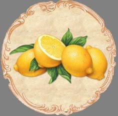 three lemons with green leaves on a white background in a gold frame around the edges