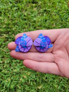 1 x Pair of Funky Floral (in shades of purple) Stud Earrings  - Approx.size 3cm - Handmade Polymer Clay earrings with surgical stainless steel backs and posts. - slight variations may occur due to each item being handmade. - Colours may vary slightly from image - Handle with care. Items are fragile if dropped may cause damage. Unique Purple Polymer Clay Earrings, Unique Hand Painted Purple Earrings, Purple Plug Earrings For Pierced Ears As A Gift, Purple Plug Earrings As Gift, Unique Purple Flower Earrings, Handmade Purple Polymer Clay Flower Earrings, Hand Painted Purple Earrings As Gift, Purple Polymer Clay Earrings, Thumb Prints