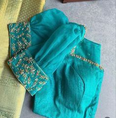 Hand embroidered ready made saree blouse / crop top/stitched saree blouse usa / saree blouse/modern blouse/zardosi blouse/blue saree blouse/ pure silk blouse/ Rama green puff sleeve maggam work blouse /turquoise blue puff sleeve blouse        It is very true that a perfect blouse is the one which makes your saree look stand out !! If you find one of such a style that you have been wanting to have then dont let it go !! we carry such unique trending blouses that instantly add a stylish look to any saree !!     Well..!! we understand that you may not get in your desired size/pattern, here you go with customization according to your size/pattern which we can deliver in 1-2 weeks of time period !!      Here is a beautiful Hand embroidered saree blouse/crop top  in turquoise blue color that has Applique Work Blouse Designs, Fitted Tissue Silk Blouse With Resham Embroidery, Semi-stitched Tissue Silk Blouse With Floral Embroidery, Festival Cotton Silk Blouse With Intricate Embroidery, Cotton Silk Blouse With Intricate Embroidery For Festivals, Fitted Tissue Silk Blouse With Dori Work, Fitted Tissue Silk Blouse With Floral Embroidery, Fitted Floral Embroidered Tissue Silk Blouse, Blue Embroidered Tissue Silk Blouse Piece