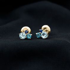 Product Details These Three Stone Stud Earrings embellished with Round Shape Sky Blue Topaz, London Blue Topaz and Blue Sapphire Gemstones are set in a Prong Setting. Product Information SKU SHP-EARRINGS102025073 Length 6 mm Width 7.2 mm Height 3.2 mm Weight 0.88 gm (Approximate) BLUE SAPPHIRE INFORMATION No.of Stones 2 Pieces Total Weight 0.10 Carat (Approximate) Dimension(approx) Round-2X2 mm-2 Pcs Color Blue Cut Brilliant Shape Round Setting Type Prong-Setting Quality Grade AAA LONDON BLUE TO Blue Topaz Multi-stone Earrings, Blue Sapphire Gemstones With Prong Setting, Elegant Sapphire Multi-stone Earrings, Sapphire Multi-stone Earrings Fine Jewelry, Formal Blue Birthstone Earrings, Blue Birthstone Earrings For Formal Occasions, Blue Fine Jewelry Earrings For Anniversary, Blue Prong Set Fine Jewelry Earrings, Blue Earrings With Prong Setting For Anniversary