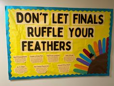 a bulletin board that says don't let finals ruffle your feathers on it