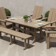 a wooden table with chairs and plates on it