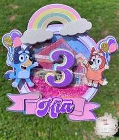 a pink and blue sign with cartoon characters on it