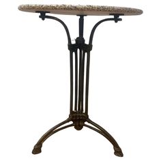 an iron table with marble top