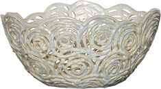 a white bowl that is made out of metal and has spiral designs on the rim