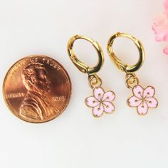 ♥ Gold Cherry Blossom Earrings Peach Plum Charm Flower Gift Japanese Cherry Blossom Jewelry Gift for Women Personalized Gift ♥ This is Beautiful Gold Cherry Blossom Earrings Charm on ear hook ♥ Alloy charm Flower Gold Plated Pink Enamel Lead & Nicker Safe Approx : 12mmx9mm x2mm **Conversion: 1 inch=25.4 mm or 1 mm=0.0393 inches** ♥ Real 18K Gold over ear hook 14.5x12 mm ♥ We strive for next day shipping, but we do not ship on Saturdays, Sundays, and Holidays. It may sometimes take a bit long Blossom Color Flower Charm Earrings For Spring, Blossom Colored Flower Charm Earrings For Spring, Blossom Flower Charm Earrings For Spring, Spring Pink Earrings With Flower Charm, Cute Gold Flower Charm Earrings, Pink Dangle Flower Earrings For Mother's Day, Pink Flower Shaped Jewelry For Spring, Pink Flower-shaped Jewelry For Spring, Cute Rose Gold Flower Jewelry