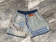 "This patchwork short was made to look cool in summers, It is handmade with different patterns. It comes with comfortable elastic waist, 2 pockets and ankle. These are made perfect for a relaxing day at home, working out, yoga. Made with soft rayon fabric. Details - Size - Free size Fabric - Rayon Waist - 20\" stretching to 40\" inch Hip - 30 to 46\" inch Length - 16 to 18\" inch Fit - Regular Pattern - Patchwork Color - Grey Wash - Hand wash in cold water and hang dry in the shade." Casual Beach Shorts With Patchwork, Summer Patchwork Shorts, Casual Patchwork Shorts For Beach, Bohemian Patchwork Shorts, Multicolor Patchwork Shorts For Vacation, Summer Festival Shorts With Patchwork, Hippie Patchwork Shorts For Festival, Patchwork Short Bottoms For Festival, Patchwork Cotton Shorts For Vacation