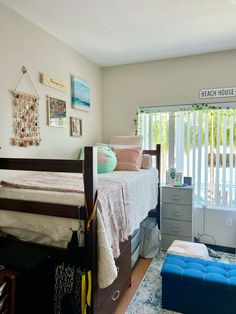 a bedroom with a bed, dresser and other items in the room that is decorated