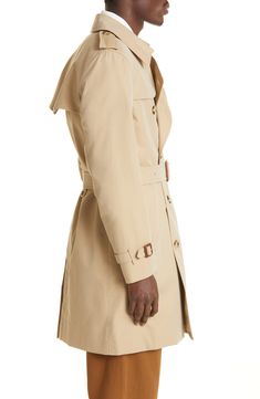 A classic double-breasted silhouette defines this mid-length trench crafted in the UK from water-repellent cotton gabardine and styled with a removable belt. 39" length (size 50EU) Double-breasted button closure Notched lapels with hook-and-eye throat latch Belted cuffs Front button-welt pockets Gun flap Storm flap Back vent Removable belt Check-print lining 100% cotton Dry clean Made in the UK Men's Designer Clothing Classic Gabardine Outerwear With Double-breasted Fastening, Classic Double-breasted Gabardine Outerwear, Classic Outerwear With Belted Cuffs, Classic Gabardine Belted Outerwear, Classic Belted Raincoat For Work, Classic Long Gabardine Raincoat, Classic Gabardine Pea Coat, Classic Gabardine Raincoat For Work, Classic Workwear Raincoat With Button Closure