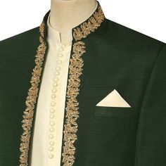 Elevate your style with this exquisite deep green prince coat from Pakistan, made with premium quality raw silk fabric and an open front design. Adorned with beautiful golden hand work embroidery, this coat is sure to turn heads on your special event.The rich green hue of the coat is complemented by the intricate detailing of the embroidery, creating a look that is both regal and refined. The coat is tailored to perfection, ensuring a flattering fit that will accentuate your figure.This prince c Luxury Traditional Green Nehru Jacket, Elegant Embroidered Raw Silk Bandhgala, Elegant Embroidered Silk Sherwani, Elegant Raw Silk Bandhgala With Intricate Embroidery, Elegant Nehru Jacket In Raw Silk With Traditional Drape, Elegant Raw Silk Nehru Jacket With Traditional Drape, Formal Silk Sherwani With Traditional Drape, Elegant Embroidered Designer Nehru Jacket, Elegant Embroidered Nehru Jacket For Designer Wear