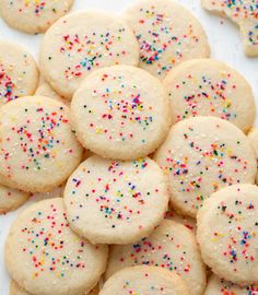 a pile of sugar cookies with sprinkles on them