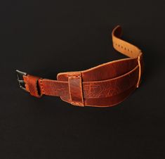 Leather watch band brown of High quality for men. Compatible with watch case 18mm, 20mm, 22mm, 24mm. Handmade bund strap is unique. Due to the peculiarity of the leather from which the strap is made, there cannot be two such identical straps.  The cuff watch strap is soft and pliable, pleasant to the touch and durable, lightweight as if weightless and comfortable. Fits perfectly on your wrist and looks stylish, enhancing the beauty of your watch. Leather watch strap in beautiful brown with a noble sheen and vintage effect. Over time, it will be covered with a patina that will emphasize the unique look of the product and its belonging to luxury accessories. Wrist watch strap is made of the best Italian leather from the Badalassi Carlo factory. Bund band in a Aviator Military Design consists Brown Bracelet Strap Watch Bands, Brown Cuff Watch With Bracelet Strap, Brown Cuff Bracelet Strap Watches, Vintage Brown Adjustable Watch Band, Adjustable Brown Wrist Strap Watch Accessories, Brown Cuff Watch With Leather Strap, Adjustable Brown Cuff Watch Band, Brown Adjustable Cuff Watch Band, Brown Leather Strap Cuff Watch