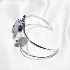 Let your lavender dreams come alive with the stunning Aria bracelet! The jade centerpiece is surrounded by swirling silver details, making for a statement piece that will look great with any outfit! Lavender jade (24x18mm) Sterling silver (925) Silver Amethyst Gemstone Cuff Bracelet, Elegant Silver Amethyst Cuff Bracelet, Amethyst Silver Jewelry With Polished Finish, Lavender Jade, Silver 925, Statement Pieces, Swirl, Looks Great, Jade