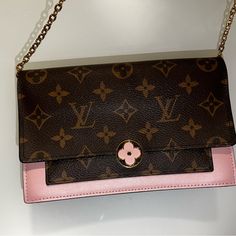 Hi There I’m Selling My Louis Vuitton Shoulder Bag It’s From The 2019 Collection, Brown Coated Canvas Printed, Gold Tone Hardware Chain Link Shoulder Strap Single Exterior Pocket Leather Lining & Dual Interior Pockets With Card Slots With Snap Closure At Front, Message Me For Any Questions Will Ship Out Asap For The Holidays! I Also Have A Ysl Bag That I Listed If Interested Please Take A Look Thank You! These Are The Measurements Shoulder Strap Drop: 20.5" Height: 5" Width: 7.5" Depth: 1.5" *My Ysl Bag Has Sold* Louis Vuitton Wallet On Chain, Luxury Tapestry Shoulder Bag, Rectangular, Chain Wallet, Brown Coat, Louis Vuitton Shoulder Bag, Wallet Chain, Hi There, Snap Closure, Card Slots