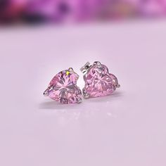 Size : 8 mm x 8 mm Main Stone Size : 8 mm x 8 mm (2 Carat / each) Main Stone Color : Pink Main Stone Shape : Heart Cut Metal : Real Solid 925 Sterling Silver Hallmark : 925 Stones Setting : Prong Finish : High Polished Guaranteed High Quality Comes in a beautifully wrapped gift box Heart Cut 2 Carat Champagne Pink Sapphire Stud Earrings 925 Sterling Silver Stud Earrings Pink Heart Shaped Wedding Earrings Formal Heart Cut Earrings, Classic Diamond Cut Earrings For Valentine's Day, Pink Heart Cut Wedding Earrings, Sterling Silver Heart Earrings With Brilliant Cut For Gift, Formal Sterling Silver Heart Earrings With Prong Setting, Formal Round Heart Earrings With Prong Setting, Gift Sterling Silver Brilliant Cut Heart Earrings, Gift Sterling Silver Heart Earrings With Brilliant Cut, Gift Heart Earrings In Sterling Silver With Brilliant Cut