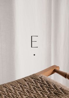 a close up of a chair with the letter e on it