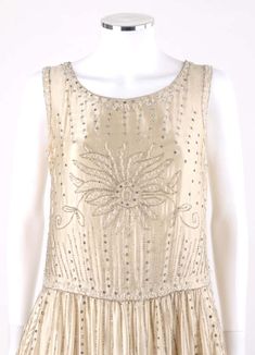 For Sale on 1stDibs - COUTURE c.1920’s One-of-a-kind Champagne Silk Floral Glass Beaded Rhinestone Flapper Dress Circa: 1920’s Style: Flapper Dress Color(s): Champagne Lined: Pink Flapper Dress, 1920s Clothes, 1920s Evening Dress, 1930s Wedding Dress, Gucci Runway, 1920s Outfits, Designer Maxi Dress, Dress Champagne, Ivory Silk